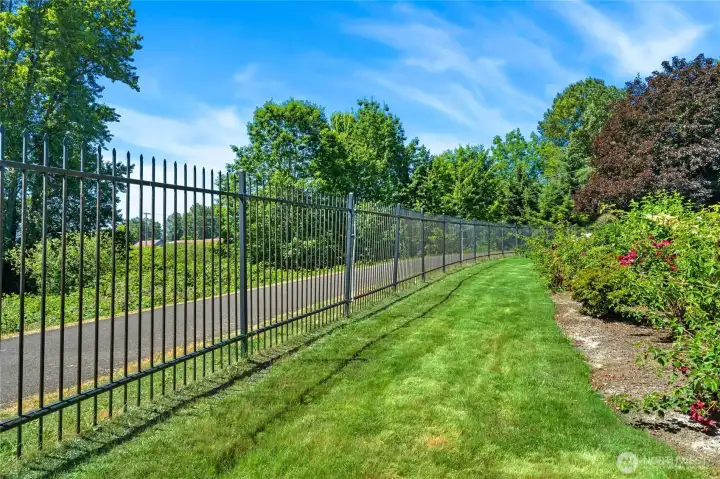 Easy access to the Green River trail, with elegant privacy fence.