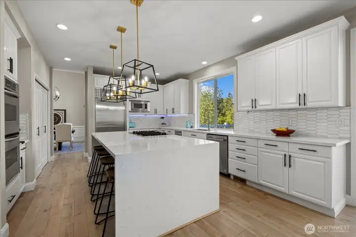 Gourmet kitchen with large island and abundant cabinetry