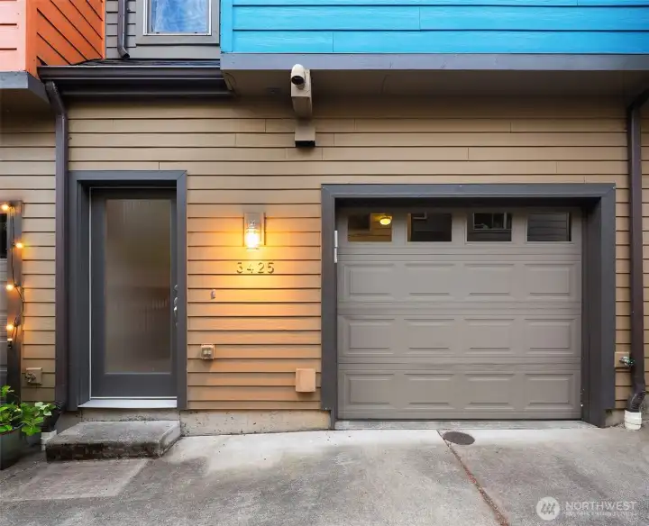 Garage with a wide drive for access. Garage with a wide drive for access.