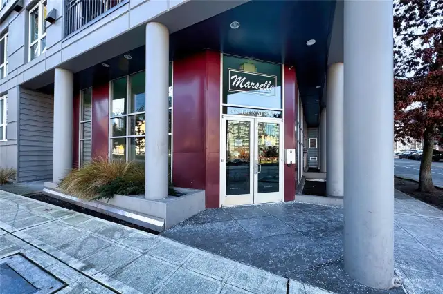 Main entry to Marselle Condominium, located on the corner of 7th & John Street, close to Amazon Headquarters, Google, SLU, Whole Foods, restaurants, retail shopping, Seattle Center, public transportation & more!