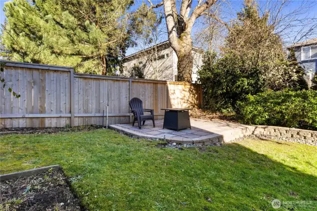 Raised paver patio in back yard.