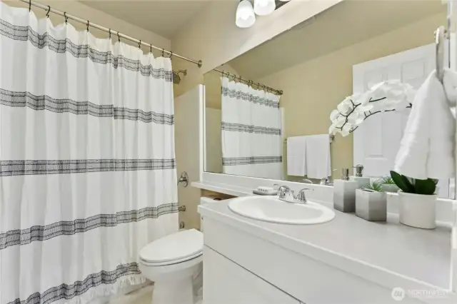 The full bathroom upstairs with a tub/shower combo.