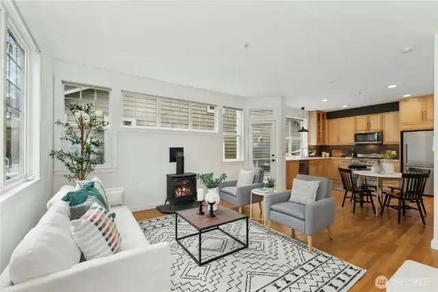 Inside find fresh paint and hardwood floors in the living area. A propane freestanding stove keeps things cozy.