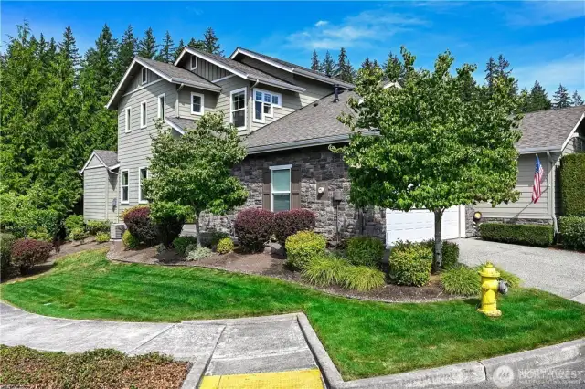 Set on a sunny, corner lot this Washington Plan offers flexible spaces for the owners.