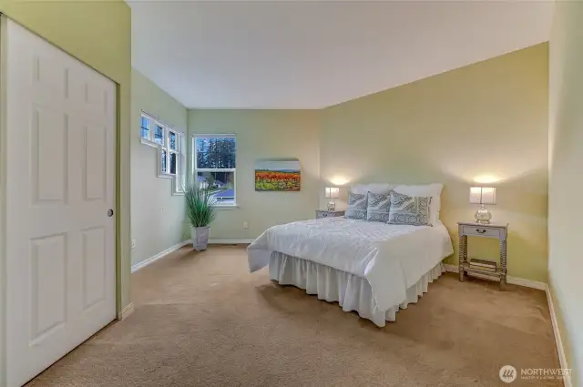 Also upstairs is the second bedroom with an adjacent full bath. This room has amazing natural light!