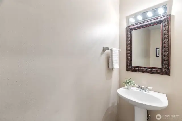 1/4 bath located off the living room