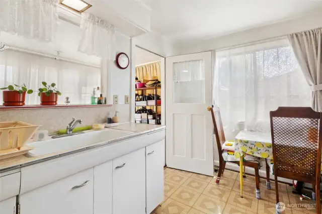 Kitchen with eating space, the doorway goes to the staircase that will lead you to the utility room.