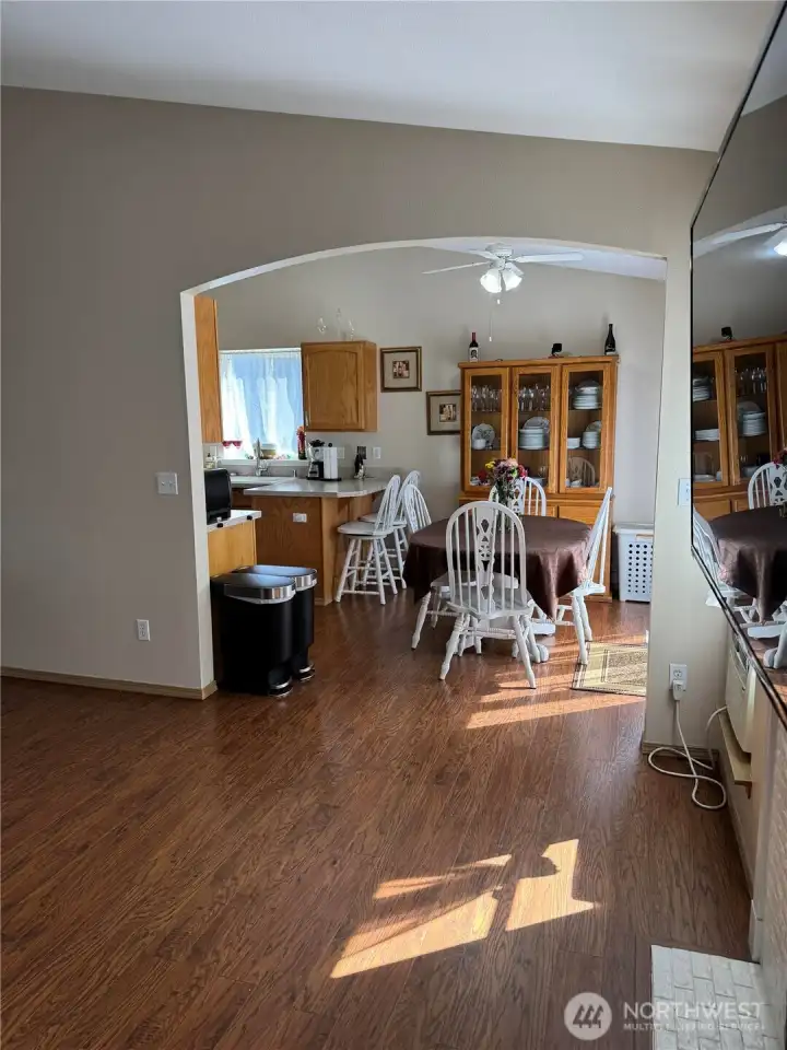 Arched pass through between nook and formal livingroom Arched pass through between nook and formal livingroom