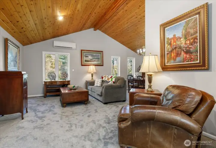 Living area part of the great room. Note the tongue & groove vaulted ceilings
