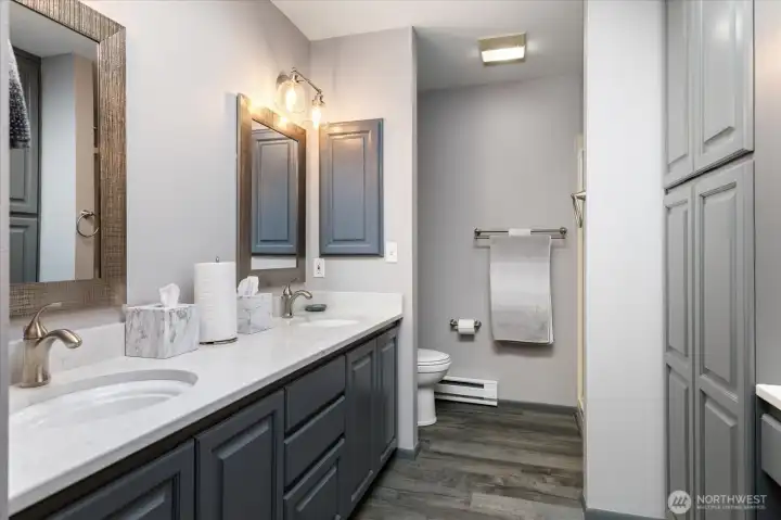 Upstairs primary bath has double vanity & big shower.