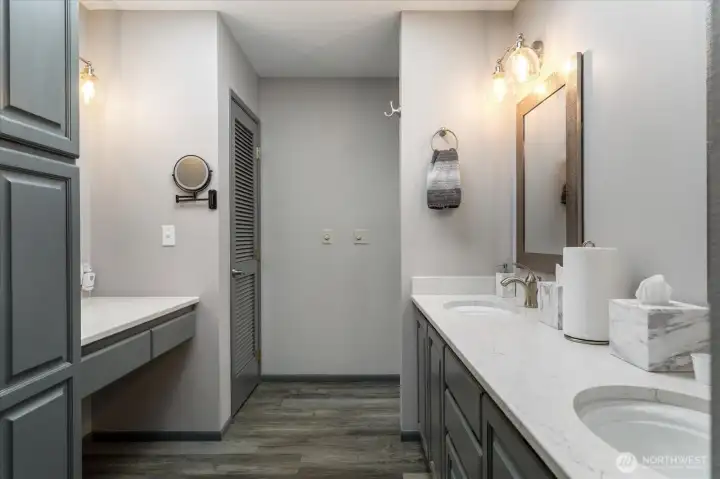 Upstairs primary bath also has makeup area