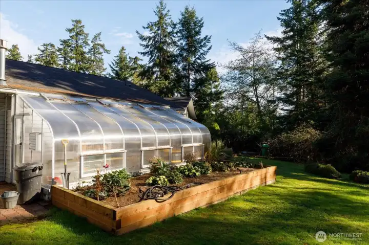 Outside view of the solarium and raised garden bed