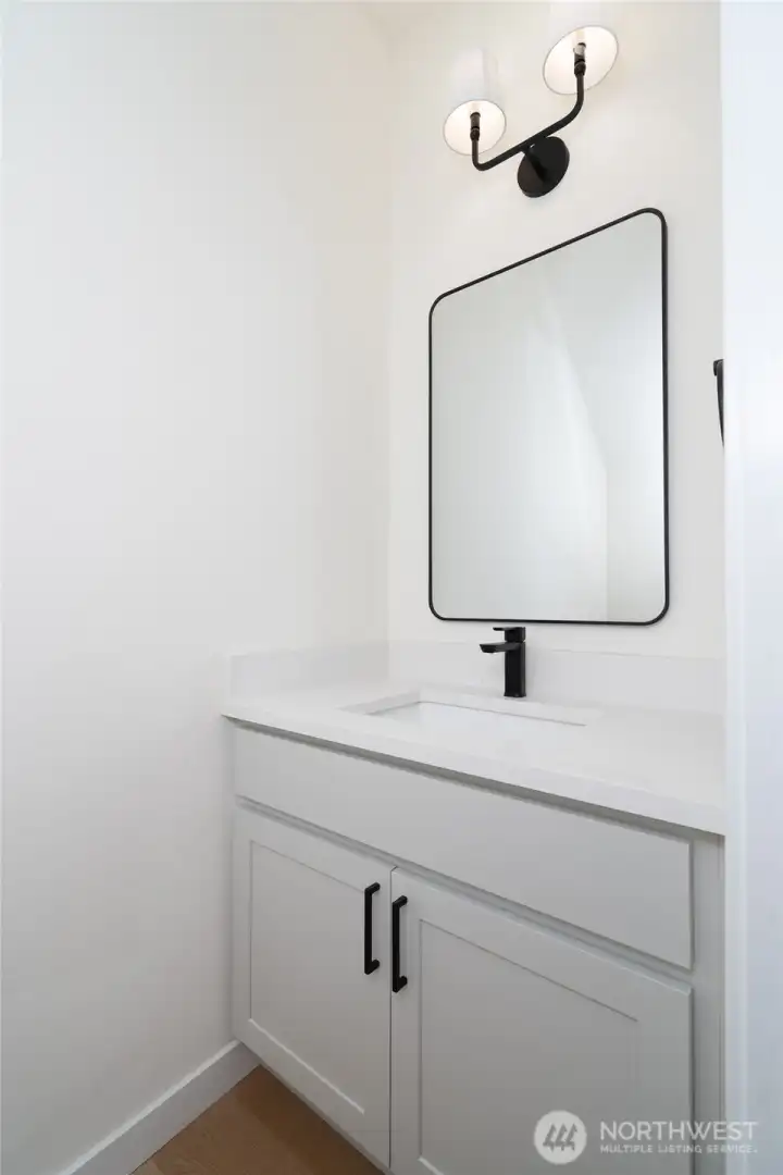 Main level guest bathroom - Pics are of a different 2389 Kyler plan home. Features and colors may differ.