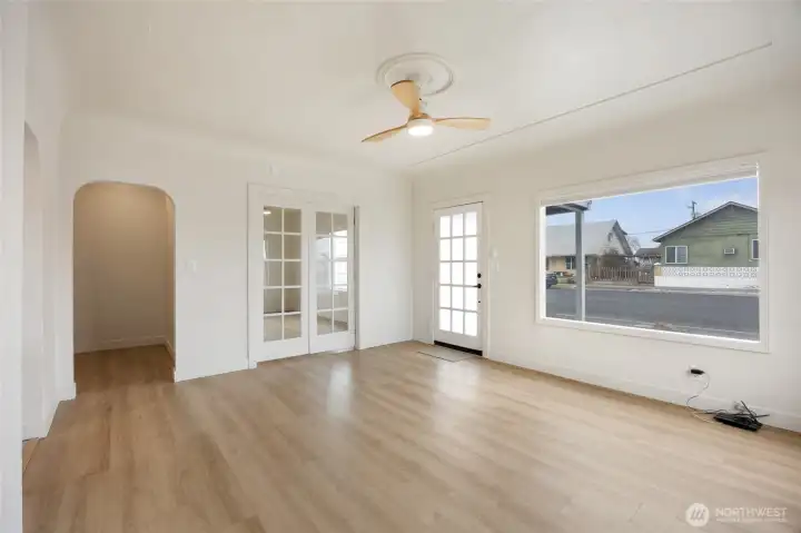 Sun filled frontroom has custom shades that open both top and bottom to control the abundance of light.
