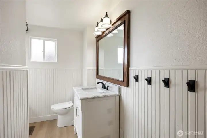 Updated upstairs remolded bathroom with marble vanity.