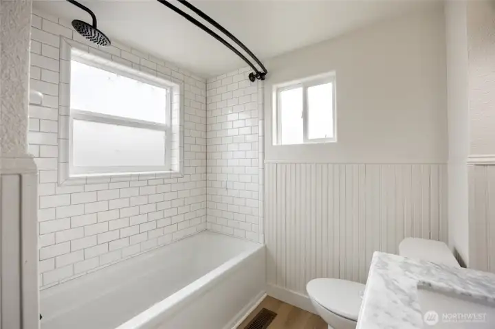 Upstairs bathroom with tile tub.