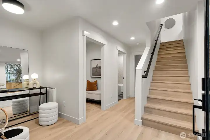 Light filled entry way leads up to main floor living