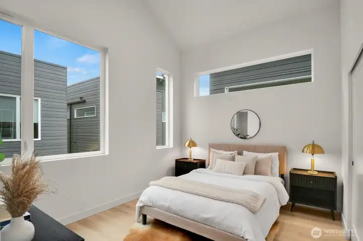 Second bedroom has vaulted ceilings and cool clerestory window to let in morning light.