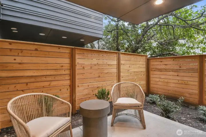 with glass door leading to covered, private backyard patio