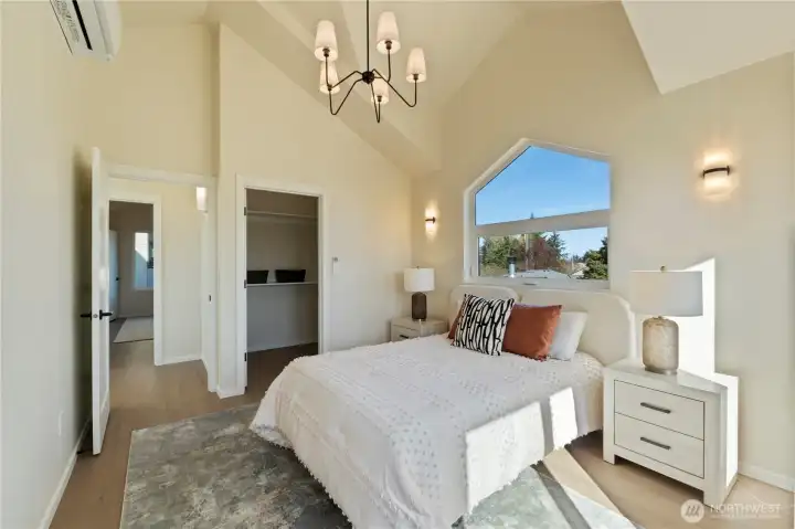 Primary bedroom with walk in closet on the upper level