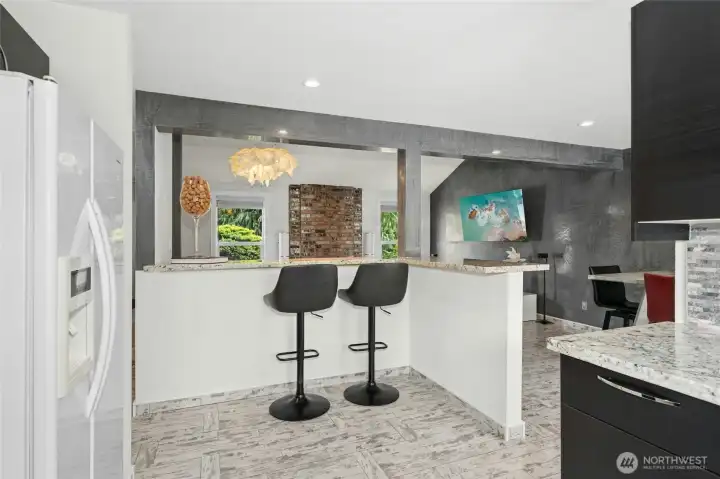 Kitchen includes bar seating