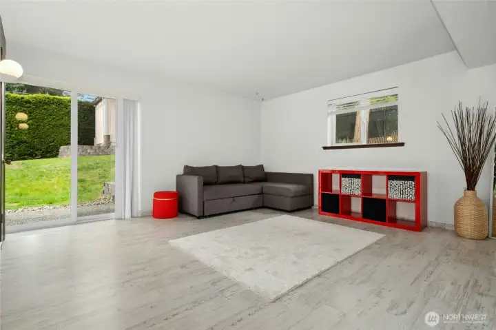 The lower level offers excellent flexibility with a second kitchen, spacious rec room, and separate entrance—ideal for a potential ADU or multi-generational living.