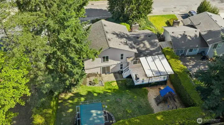 a presidential 50-year roof, an attached two-car garage, and mature landscaping