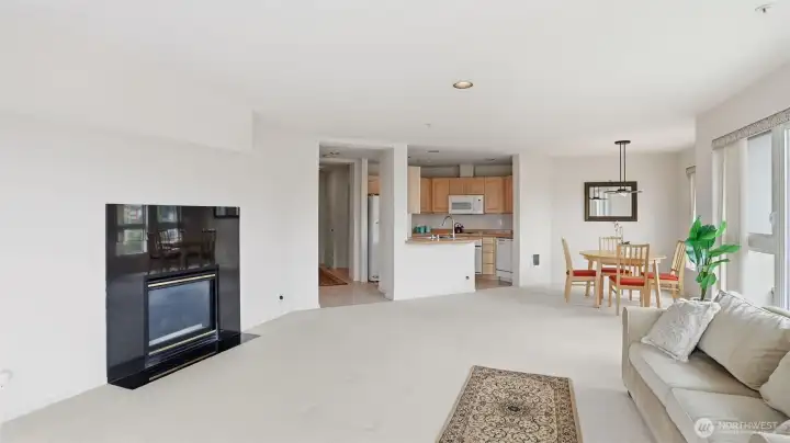 The open-concept layout connects the kitchen, dining, and living areas.