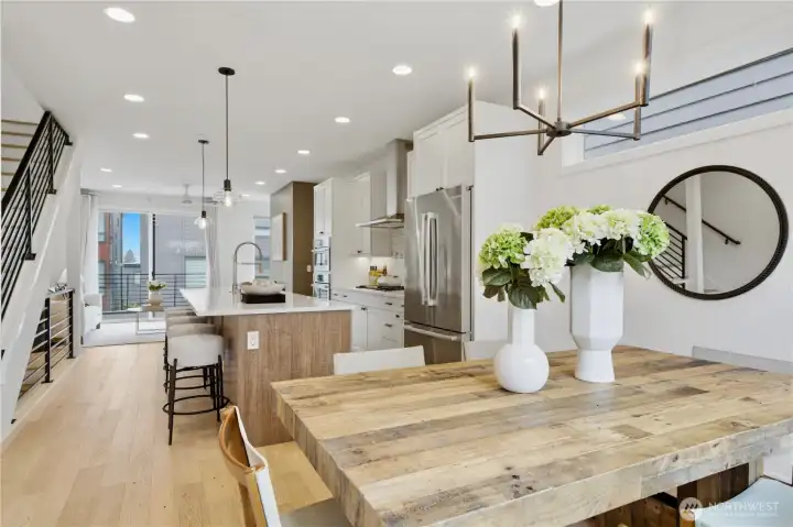 Dining area with designer light fixture