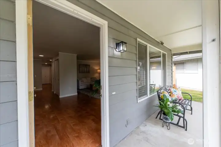 You are greeted with warm wood floors, extra wide hallway, large living room and light drenched rooms.