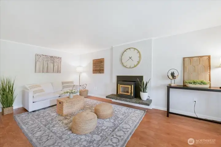 As you enter your home the living space is off to the right and kitchen/ dinning to the left. Cozy pellet stove for chilly days