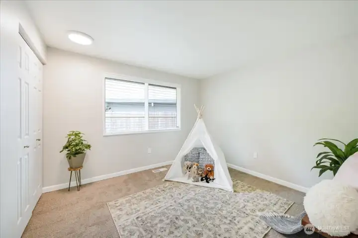 First bedroom on the right side of the hallway across from the main full bath.