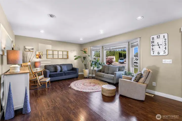 Front living room on the main level overlooks the front yard and neighborhood Front living room on the main level overlooks the front yard and neighborhood