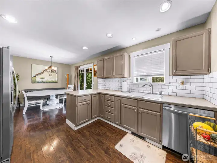Kitchen offers generous counter space, abundant cabinetry, and a seamless connection to the dining area Kitchen offers generous counter space, abundant cabinetry, and a seamless connection to the dining area