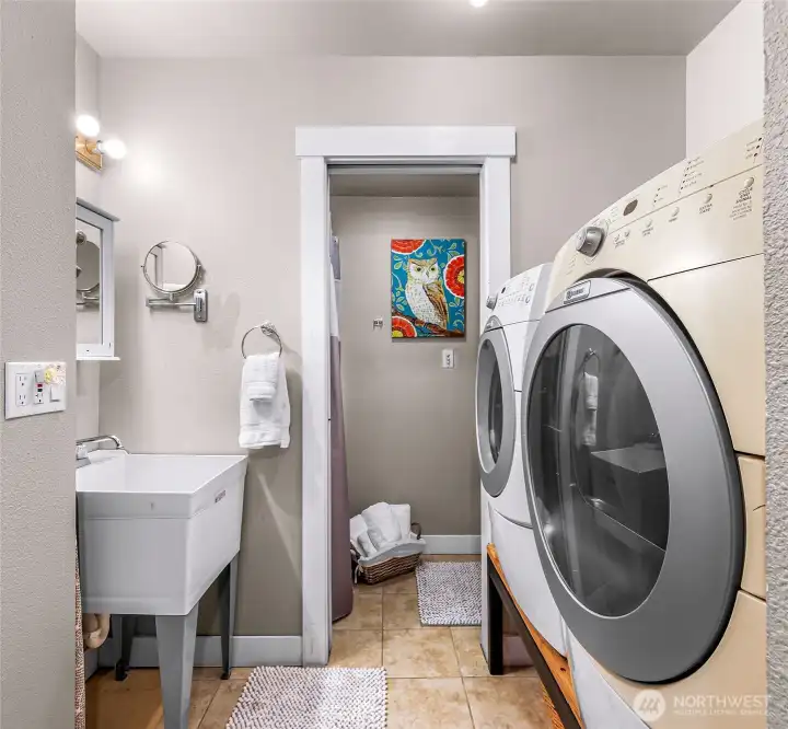 Laundry room, utility sink, + a half bath with shower for added convenience Laundry room, utility sink, + a half bath with shower for added convenience