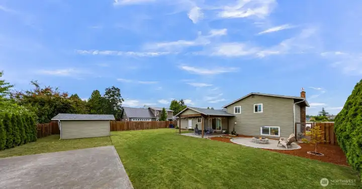 This back yard is HUGE! Check out the fire pit area!! This back yard is HUGE! Check out the fire pit area!!