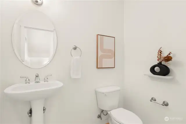 Powder room off the kitchen on the 2nd level.