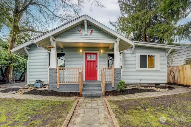 Beautiful front porch and large front yard fully fenced for privacy