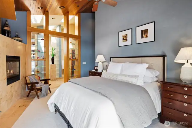 Primary suite with ensuite bathroom and gas fireplace