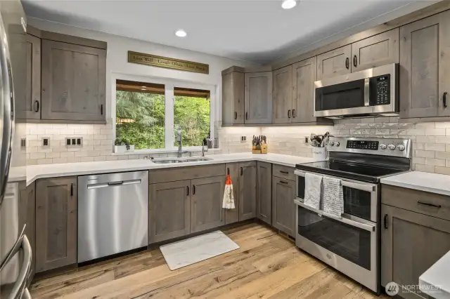 Plenty of counter space and cabinets in the beautifully updated kitchen.