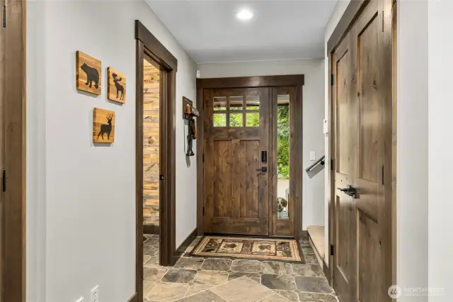 Entry way with powder bath, coat closet and upstairs access.