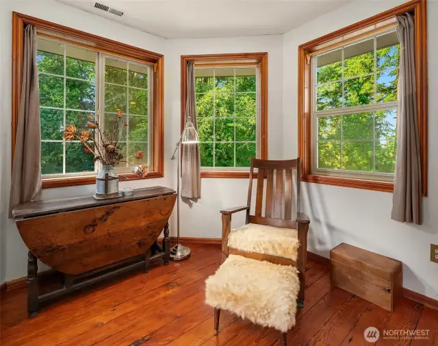 Primary sitting area surrounded by windows.