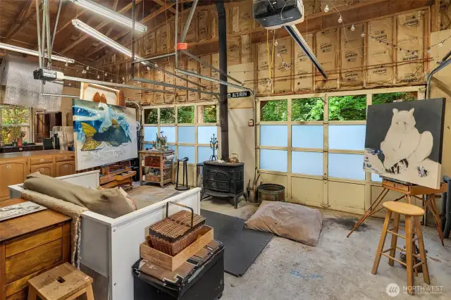 Two-car garage is enormous with high ceilings and tons of light. Currently in use as a fine artist's studio.