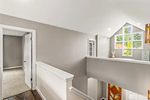 Cat walk showing loft and lots of windows, cat walk currently being used as an office, could be used as a yoga room or anything