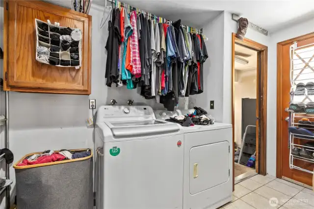 Laundry off two car garage and back door. Dor washing station to the left.
