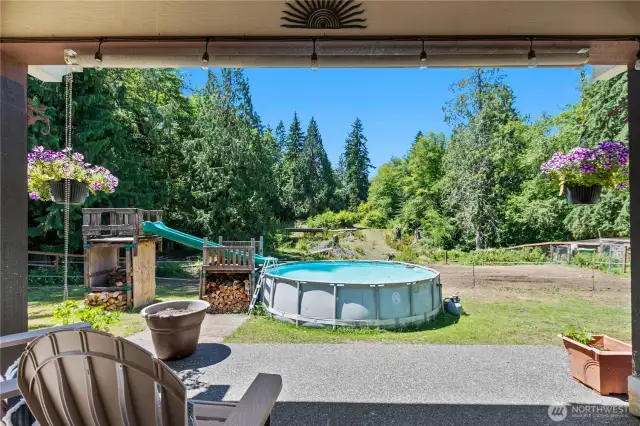 Large back patio looking out to your above ground pool