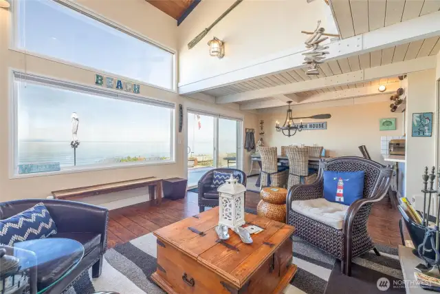 Living room w/wood fireplace & views.