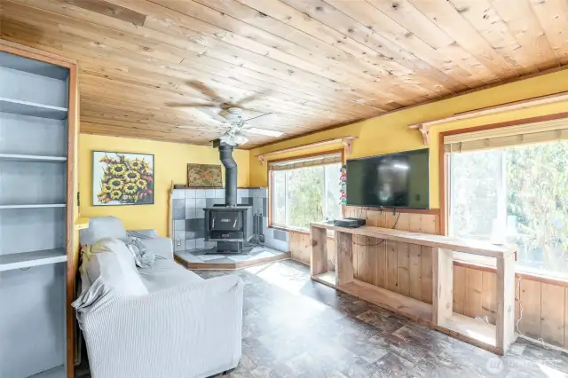 New Flooring and Cedar Tongue And Groove Paneling Throughout Kitchen And Living Room