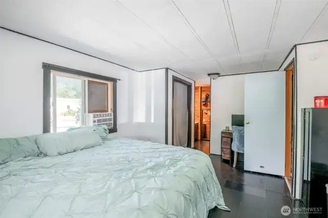 Primary Bedroom With View To Bathroom
