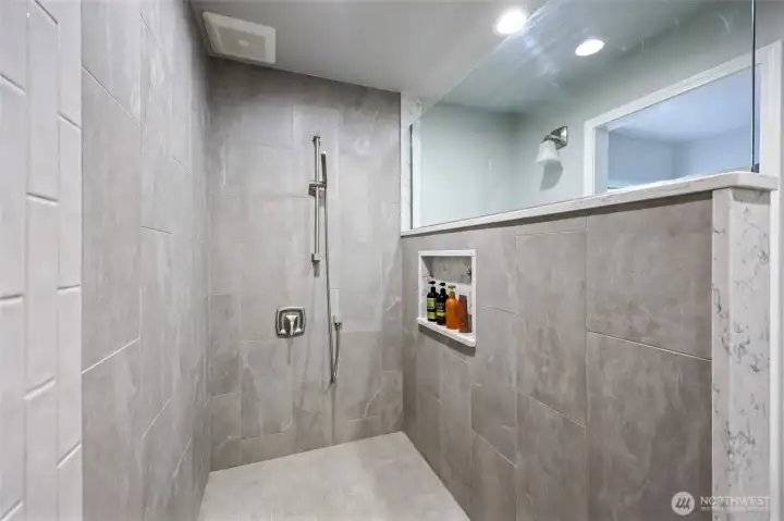 Primary suite bathroom with walk in shower.